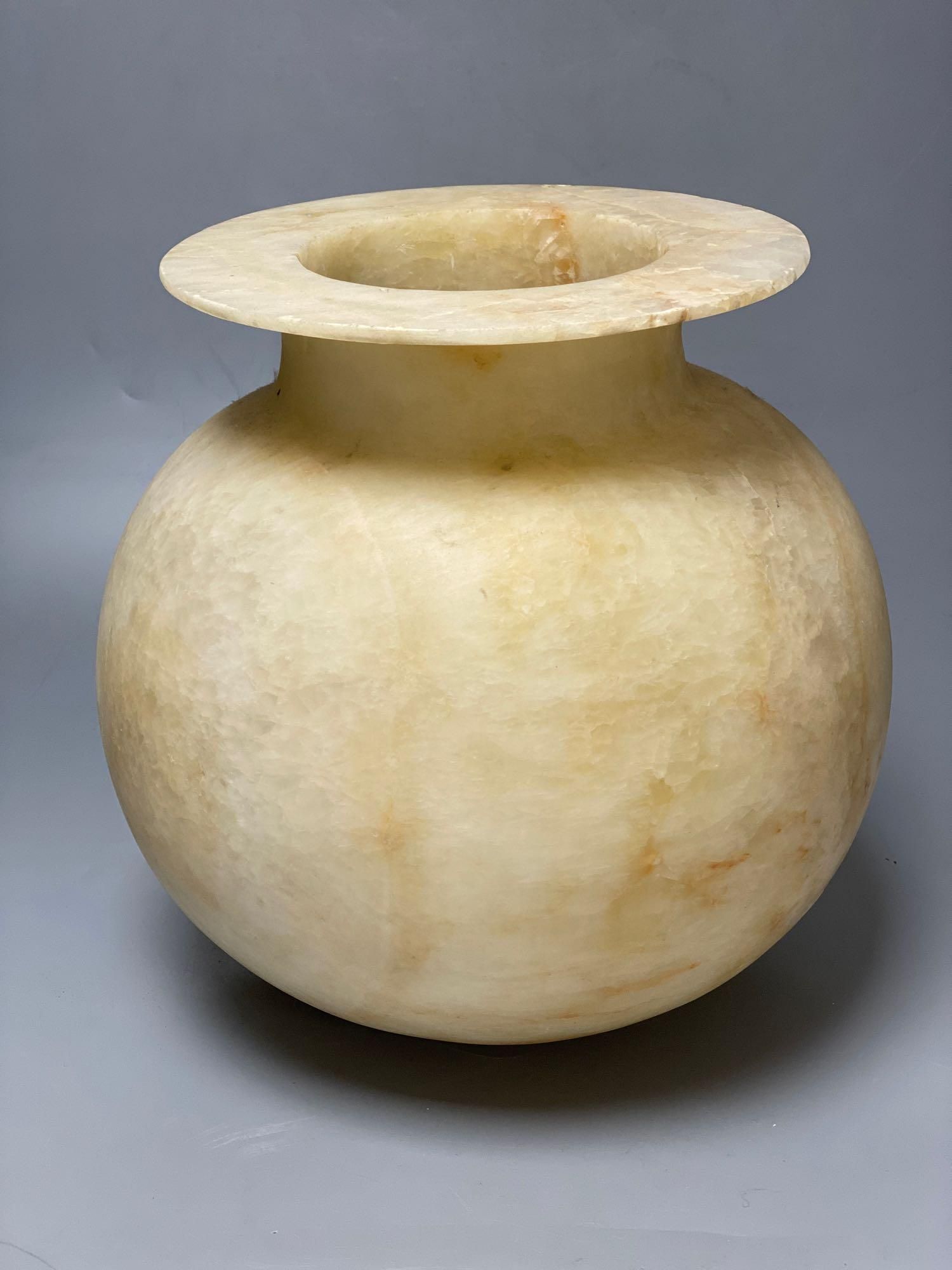 An alabaster bowl with everted rim, height 27cm